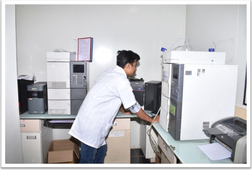 Analyst working at laboratory instrumentation